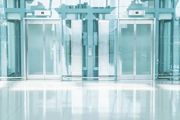 Transparent elevator in underground passage — Stock Photo, Image