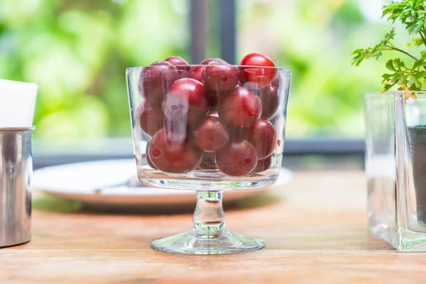 Cherry in bowl on dinning table — Stock Photo, Image