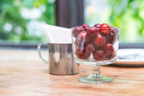 Cherry in bowl on dinning table — Stock Photo, Image