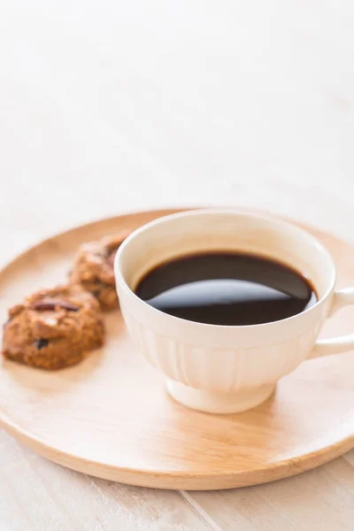 Black coffee with cookies — Stock Photo, Image