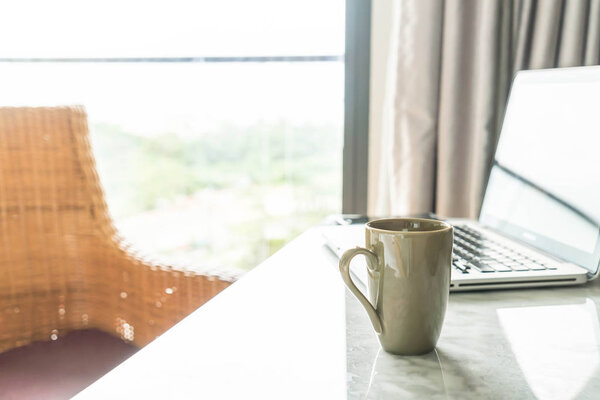 coffee cup with laptop and beautiful luxury table decoration in 