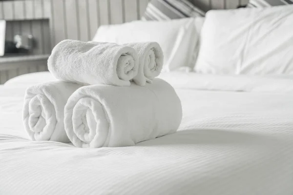 White Fluffy Towels On Bed In Hotel Bedroom Close Up View Stock