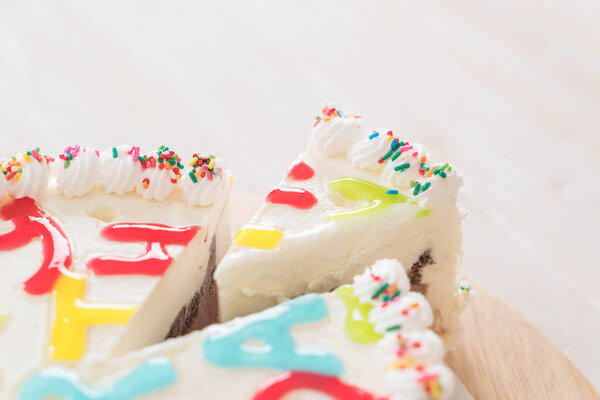 Happy birthday cake on table