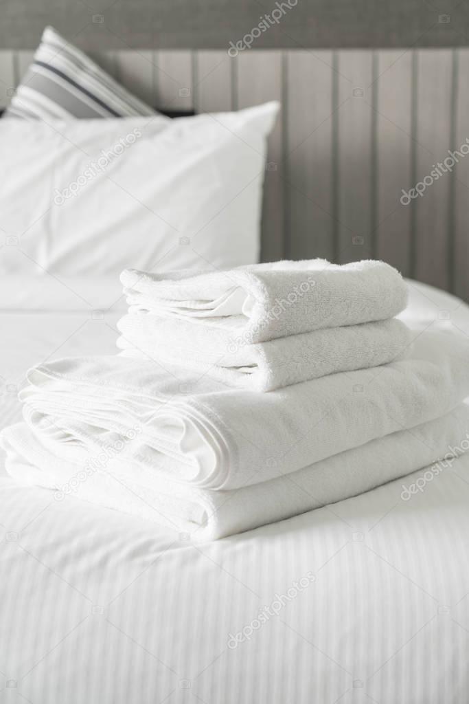 White towel on bed decoration in bedroom interior 