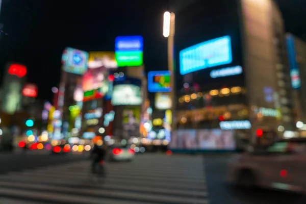 Abstrakte Unschärfe verwirrt Menschen auf dem Fußgängerüberweg in Shibuya-Stadt — Stockfoto