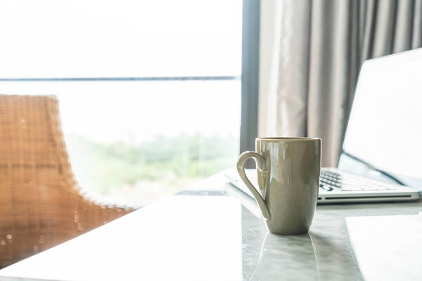coffee cup with laptop and beautiful luxury table decoration in 