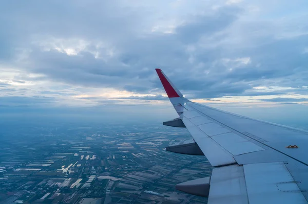 Airplane flying above clouds — Stock Photo, Image