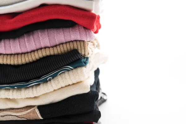 Stacks of clothing on white — Stock Photo, Image