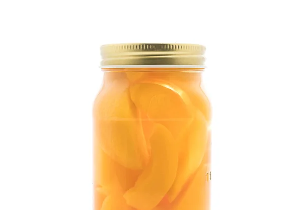 Peach in bottle on white — Stock Photo, Image