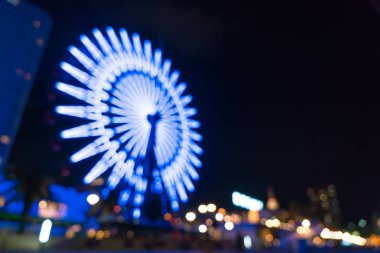 Dönme dolap ile bokeh gece liman ışıklar arka plan bulanık