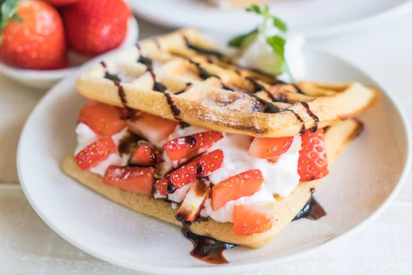 Waffle with strawberry on wood — Stock Photo, Image
