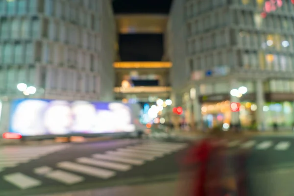 Abstrakte Unschärfe verwirrt Menschen auf dem Fußgängerüberweg in Shibuya-Stadt — Stockfoto