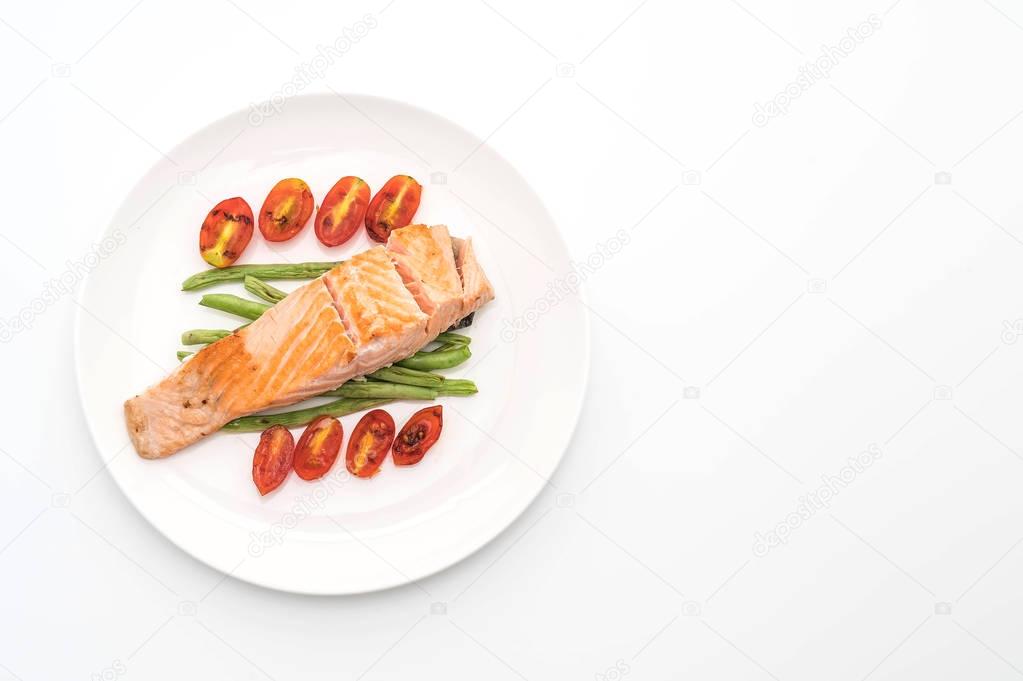 grilled salmon steak on white