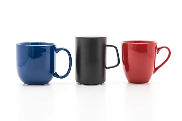 Set de tazas negras, rojas y azules sobre blanco — Foto de Stock