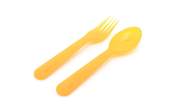 Colher de plástico amarelo e garfo — Fotografia de Stock
