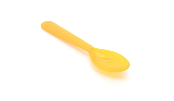 Yellow plastic spoon — Stock Photo, Image