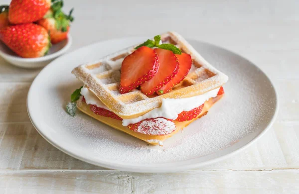 Waffle with strawberry on wood — Stock Photo, Image