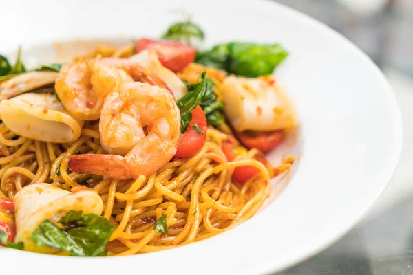 Stir-fried spicy seafood spaghetti — Stock Photo, Image