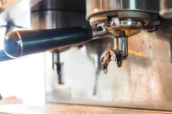 Professional coffee machine making espresso in a cafe