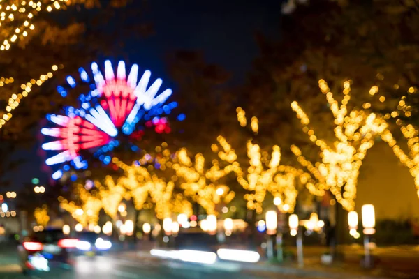 Bokeh rozostřeného noční přístav světla pozadí s ruské kolo — Stock fotografie