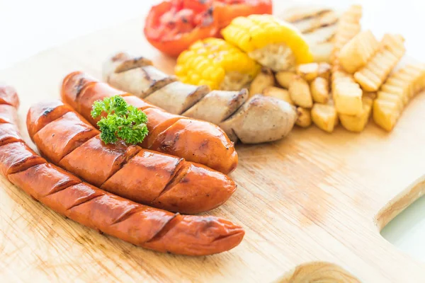 Mix grilled sausage with vegetables and french fries — Stock Photo, Image