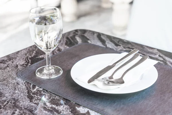 Empty plate on dinning table Royalty Free Stock Images