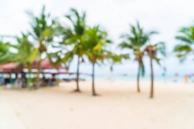 güzel hurma şemsiye ve deniz sandalyeye ile bulanıklık ve 