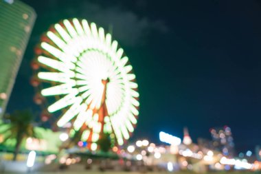 Dönme dolap ile bokeh gece liman ışıklar arka plan bulanık