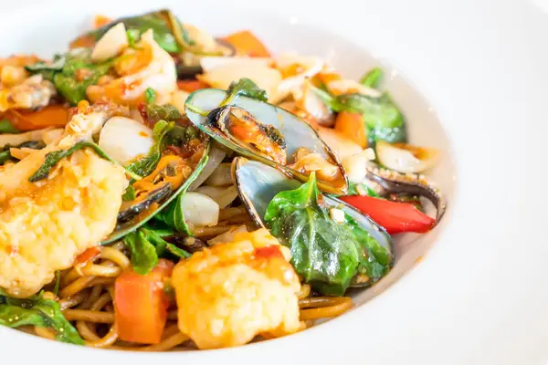 Stir-fried spicy seafood spaghetti — Stock Photo, Image