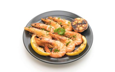 Sarımsaklı ve limonlu kızarmış karides.