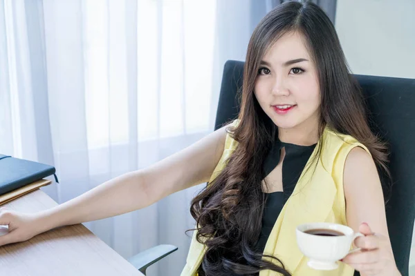 asian business woman happy with coffee cup