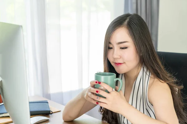 asian business woman happy with coffee cup