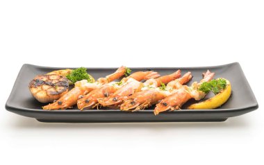 Sarımsaklı ve limonlu kızarmış karides.