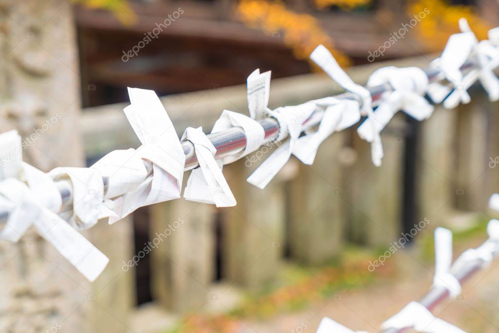 Fortune teller paper strip in temple