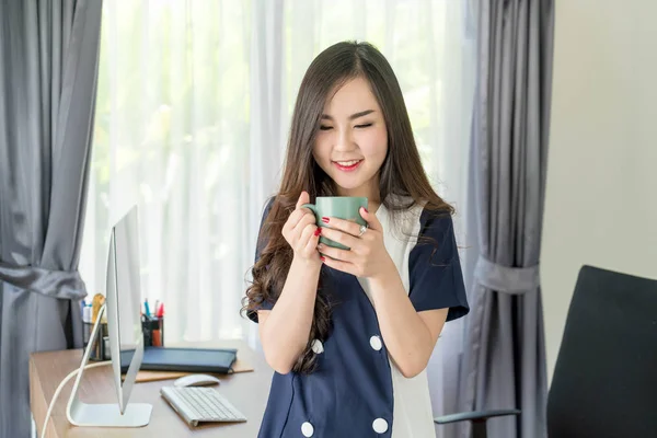 asian business woman happy with coffee cup