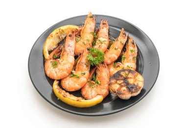 Sarımsaklı ve limonlu kızarmış karides.