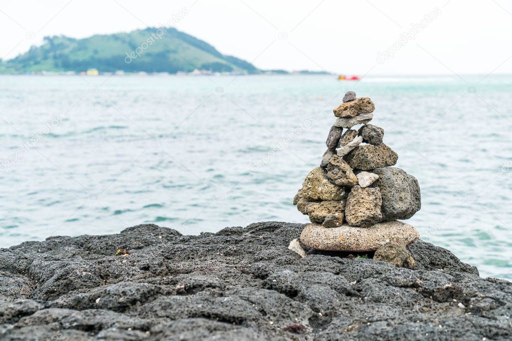 stone towers on basaltic rocks at Hyeopjae Beach,Jeju Island