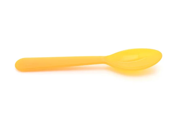 Yellow plastic spoon — Stock Photo, Image