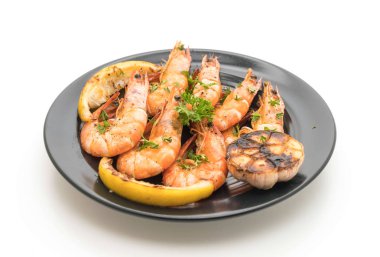 Sarımsaklı ve limonlu kızarmış karides.