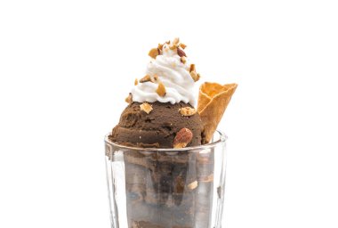 Scoop of chocolated ice cream in glass clipart