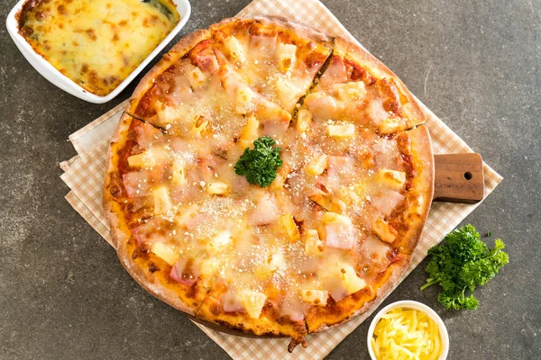 hawaiian pizza on table