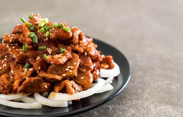 Fried pork with spicy korean sauce (bulgogi) — Stock Photo, Image