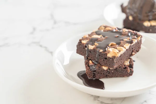 Chocolate brownies with chocolate sauce — Stock Photo, Image