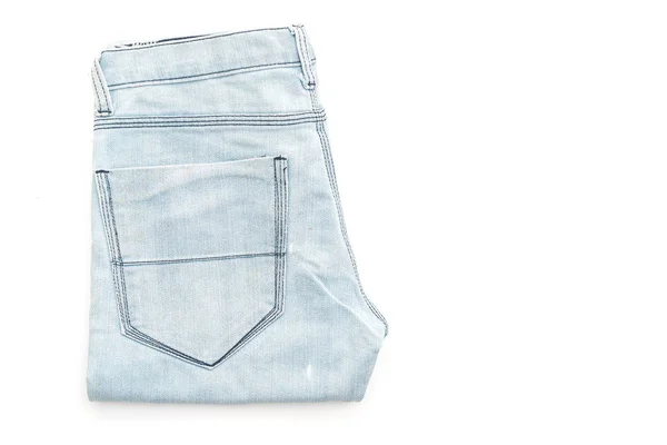 Jeans gevouwen op witte achtergrond — Stockfoto