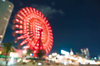 Dönme dolap ile bokeh gece liman ışıklar arka plan bulanık