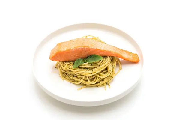 Pasta spaghetti with pesto green and salmon — Stock Photo, Image