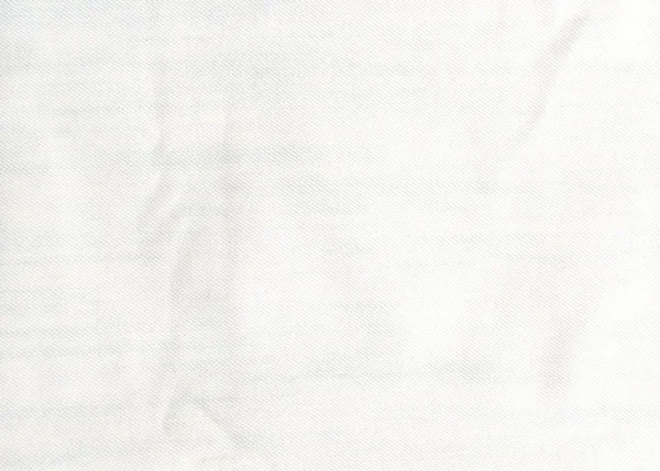 Джинсы сложены на белом фоне — стоковое фото