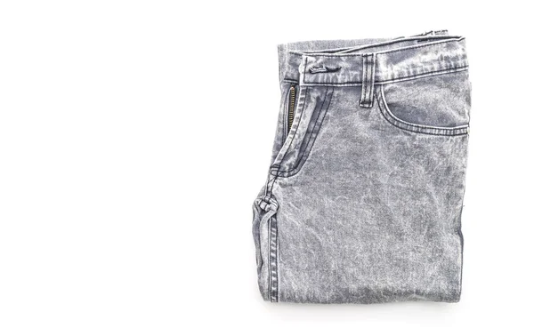 Jeans gevouwen op witte achtergrond — Stockfoto