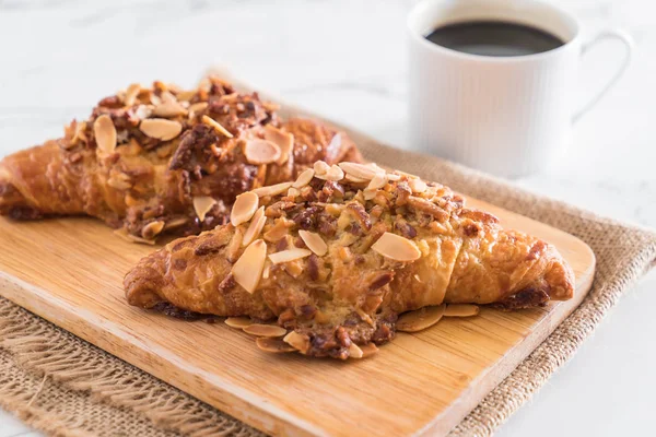 Croissant with almonds — Stock Photo, Image