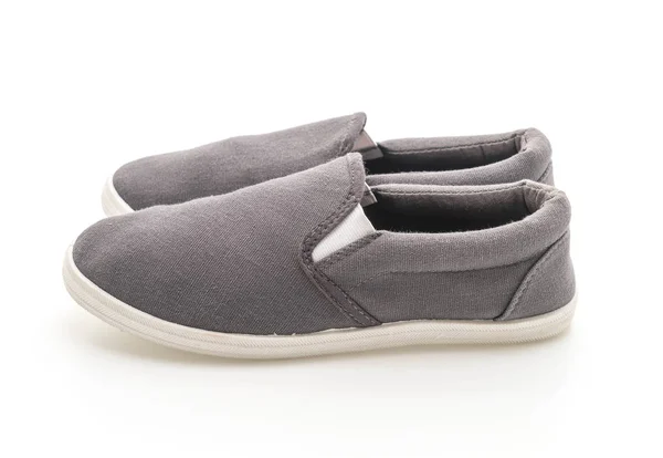 Zapatillas grises sobre fondo blanco —  Fotos de Stock